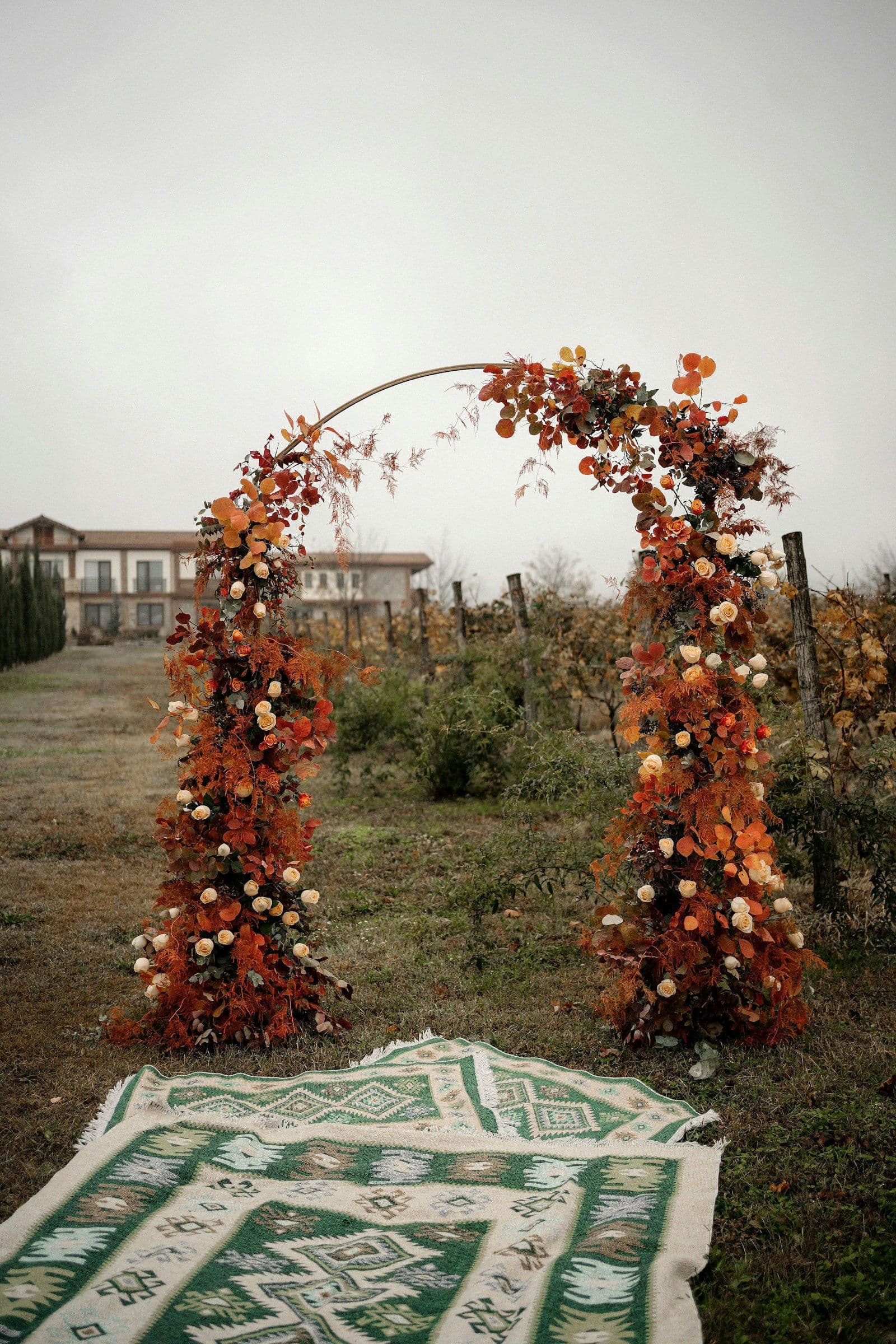 Ceremony arch woven from foliage and flowers